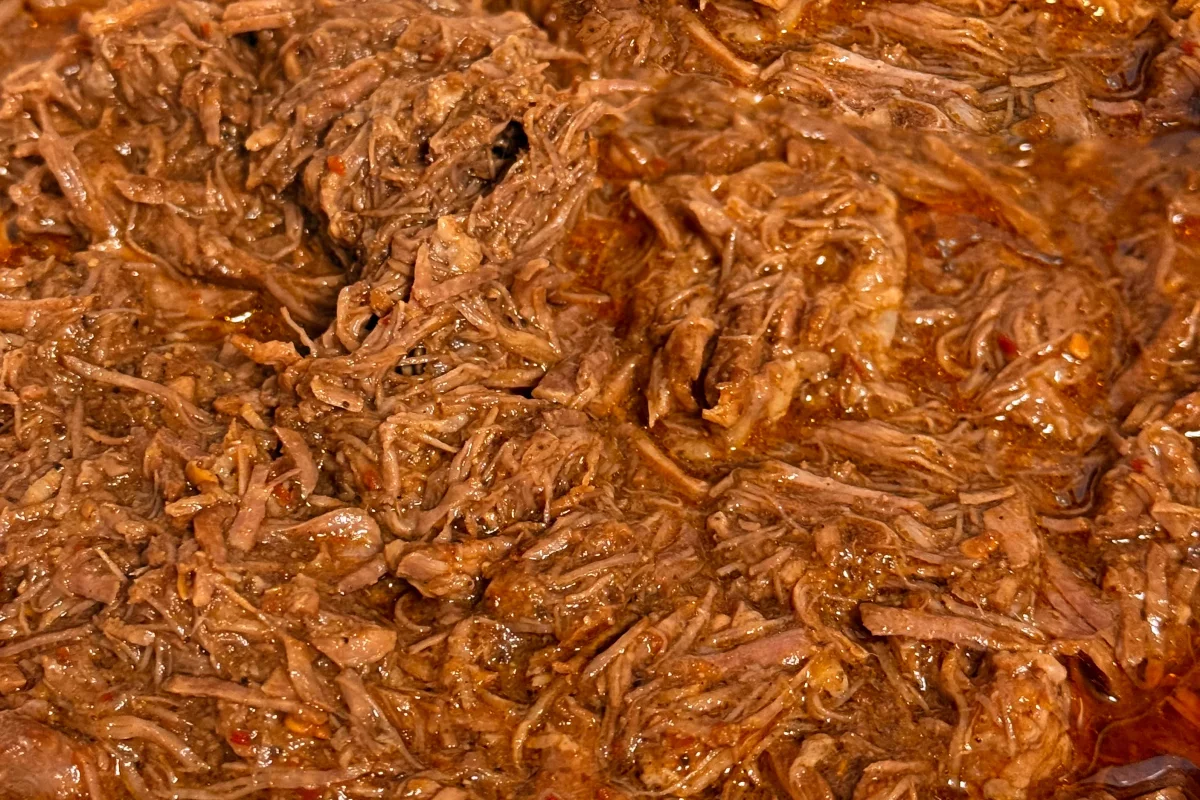 a pot of barbacoa shredded beef